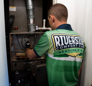 Technicians working on heating unit